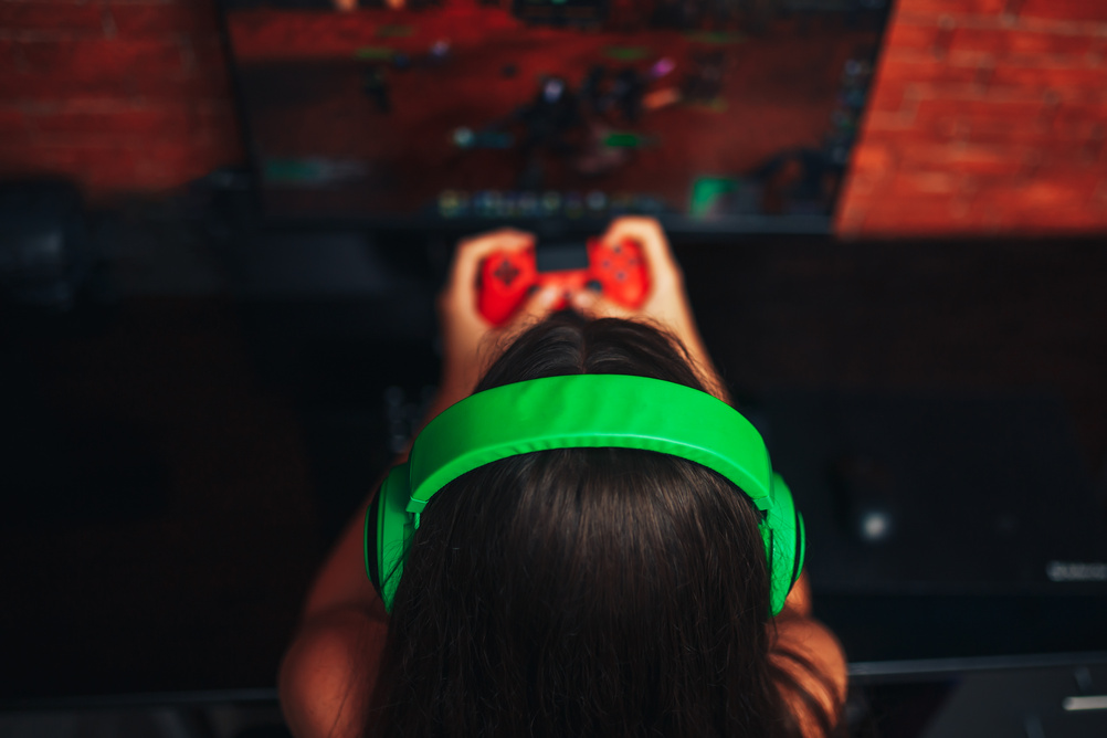 Young Girl Playing Game on Computer